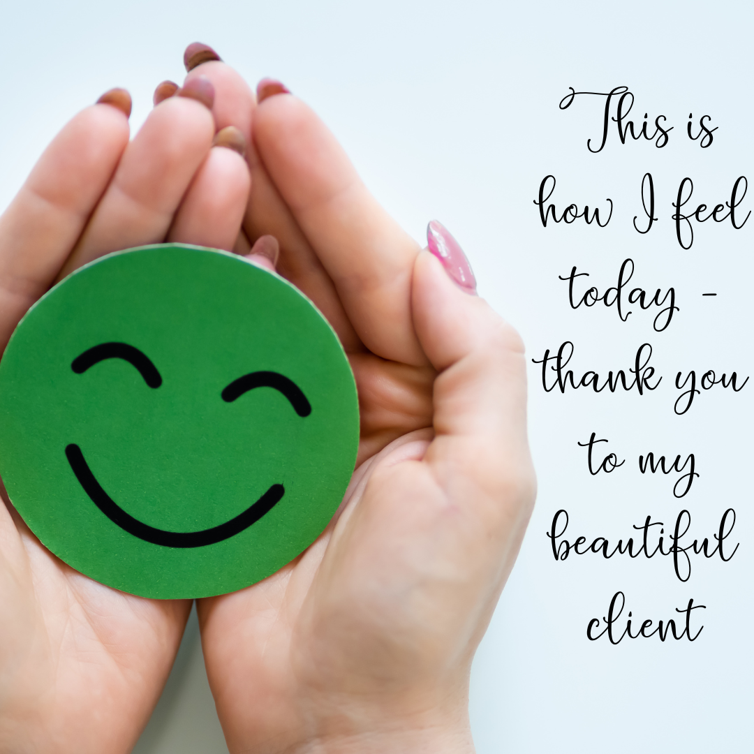 A green circle with a smiley face in a pair of hands